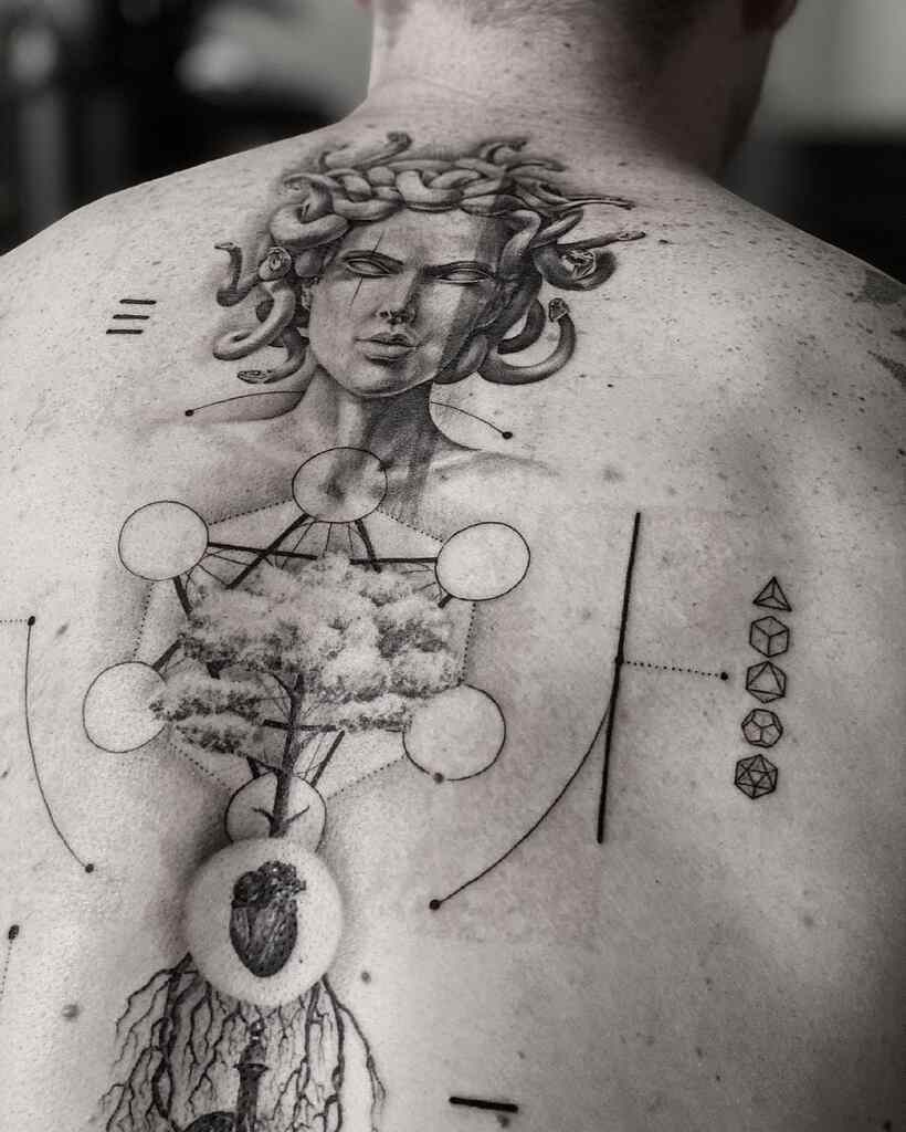 sacred geometry tattoo design on back of a man