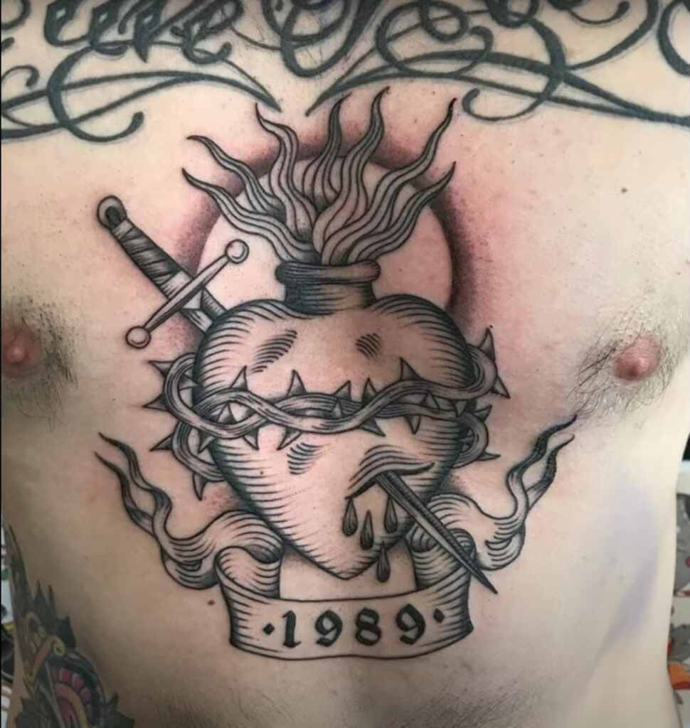 Sacred heart tattoo example for men