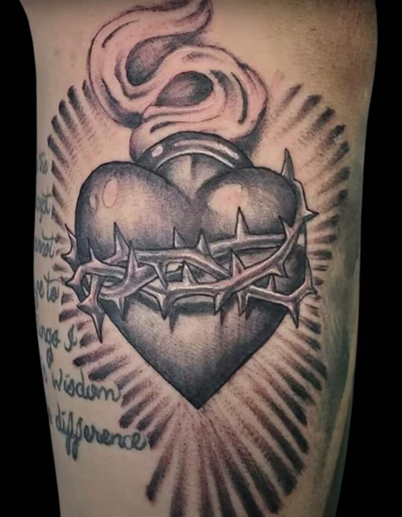 Sacred heart tattoo example for forearm.