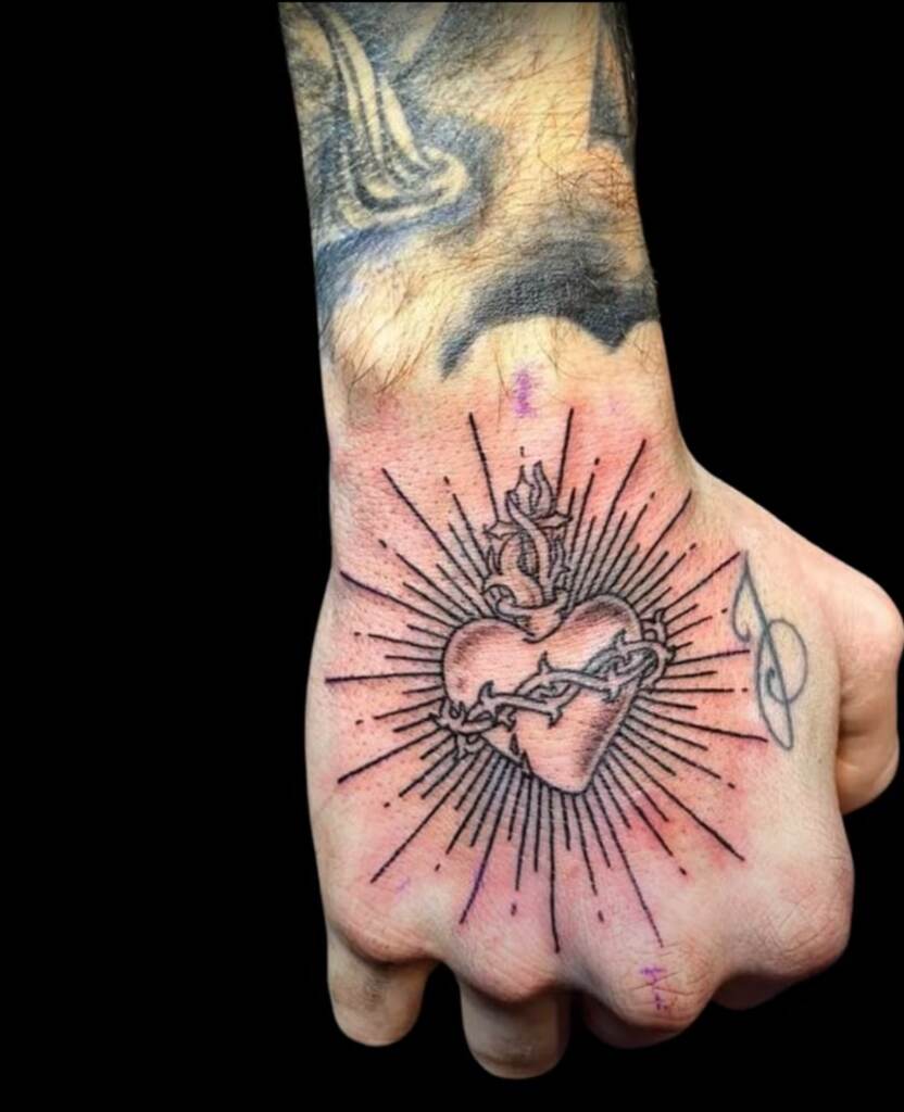Sacred heart tattoo idea ona a hand